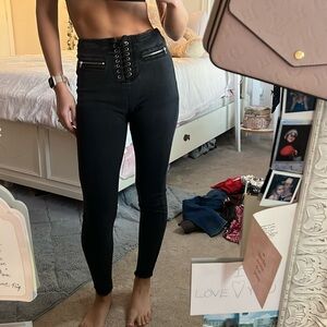 Black high-waisted lace up skinny jeans